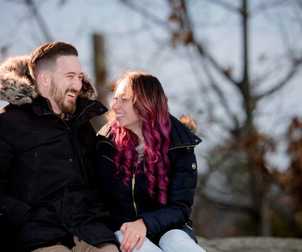 a couple sitting outdoors