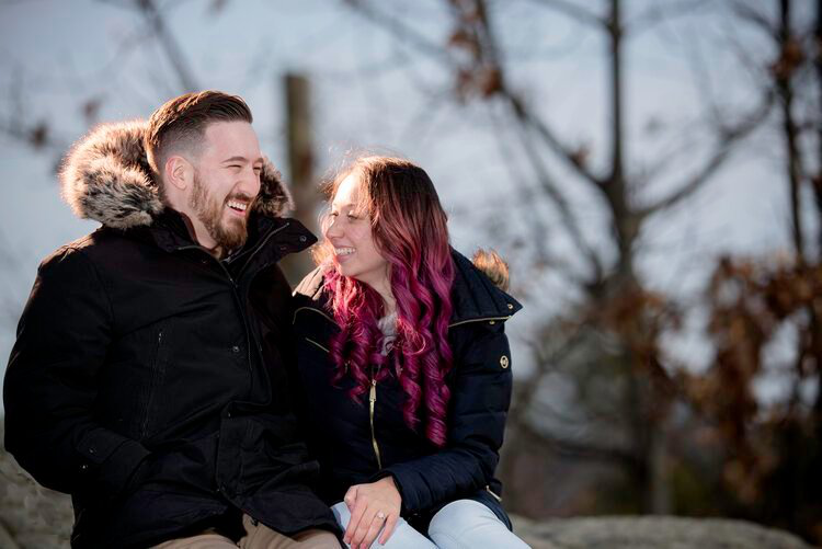 a couple sitting outdoors