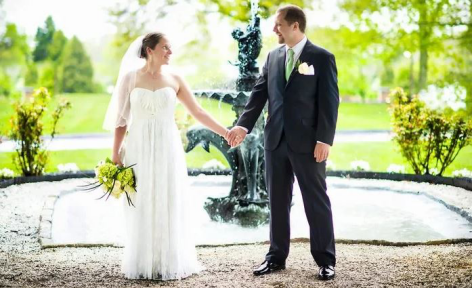 Bride and groom smiling for the camera